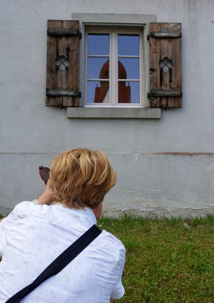 Man photographing a house